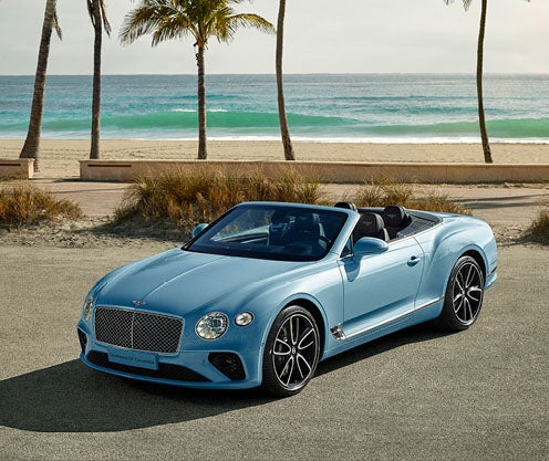 Bentley coupe parked in beach parking lot
