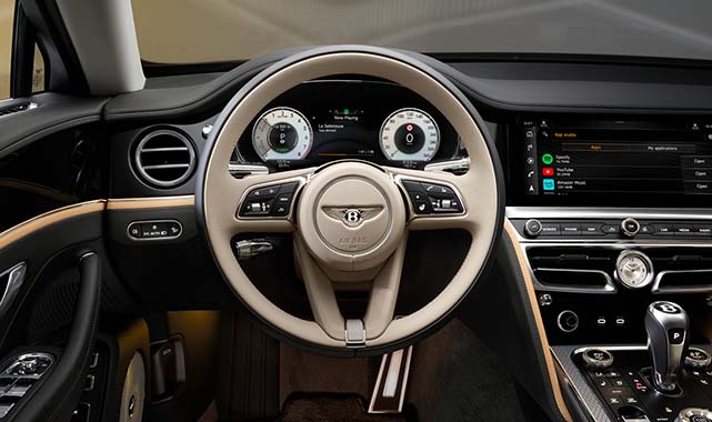 Seamlessly switch between a high-resolution touchscreen, classic analog dials, or a clean veneer panel with the Bentley Rotating Display, blending tradition with cutting-edge technology.