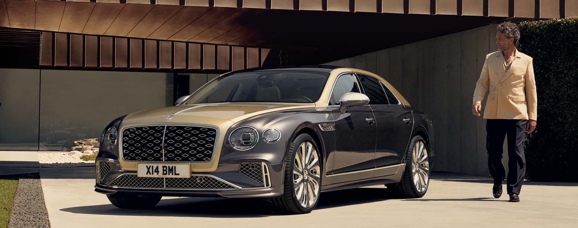 Bentley Flying Spur Mulliner parked outside beach house