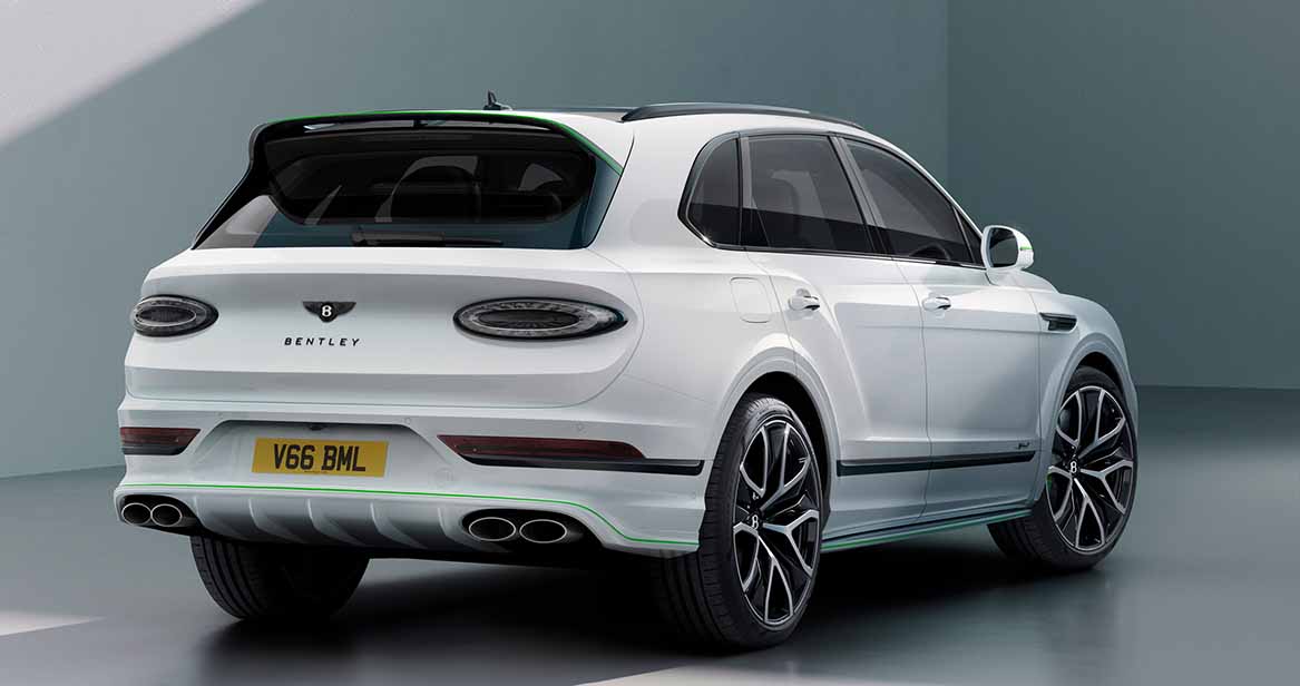 Rear three-quarter view featuring quad exhausts, black accents, and LED tail lights for a bold performance stance.