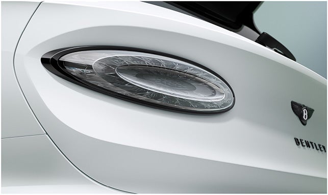 LED taillight and Bentley badge on the rear fascia of the 2026 Bentayga Speed, featuring aerodynamic design and luxury finish.
