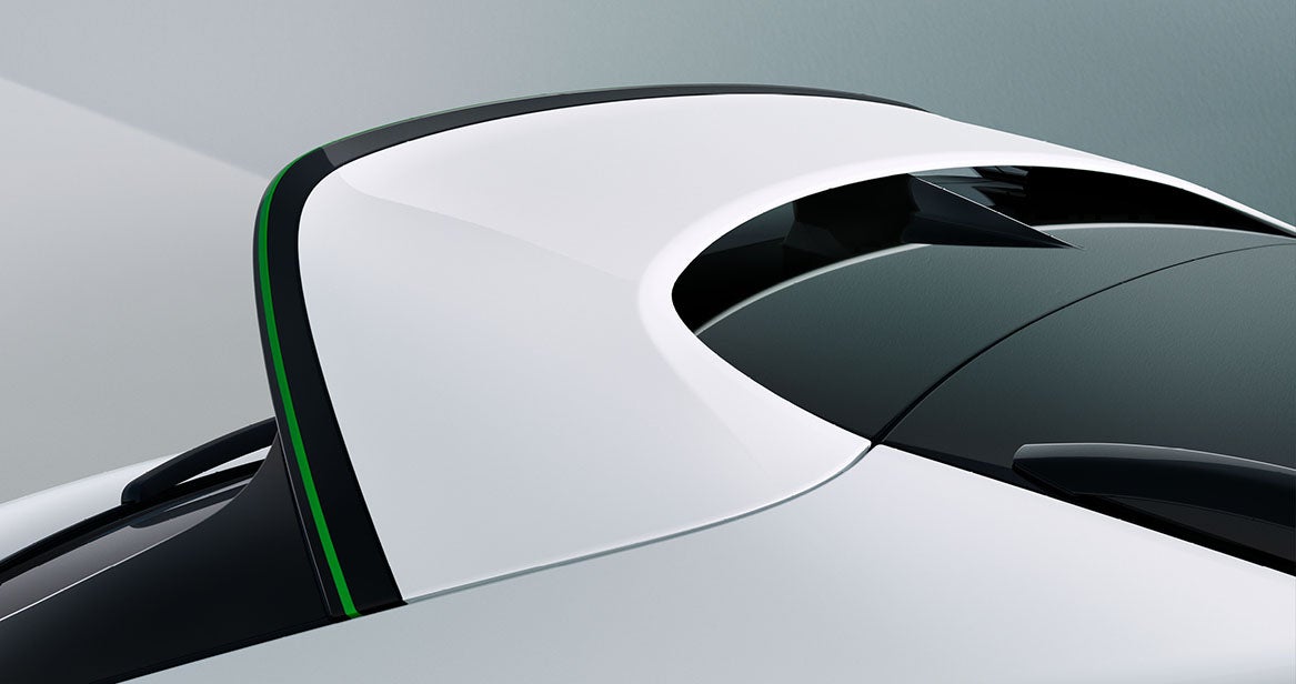 Gloss black and Glacier White roof spoiler with green accent strip on the 2026 Bentley Bentayga Speed, showcasing aerodynamic design and bespoke styling.