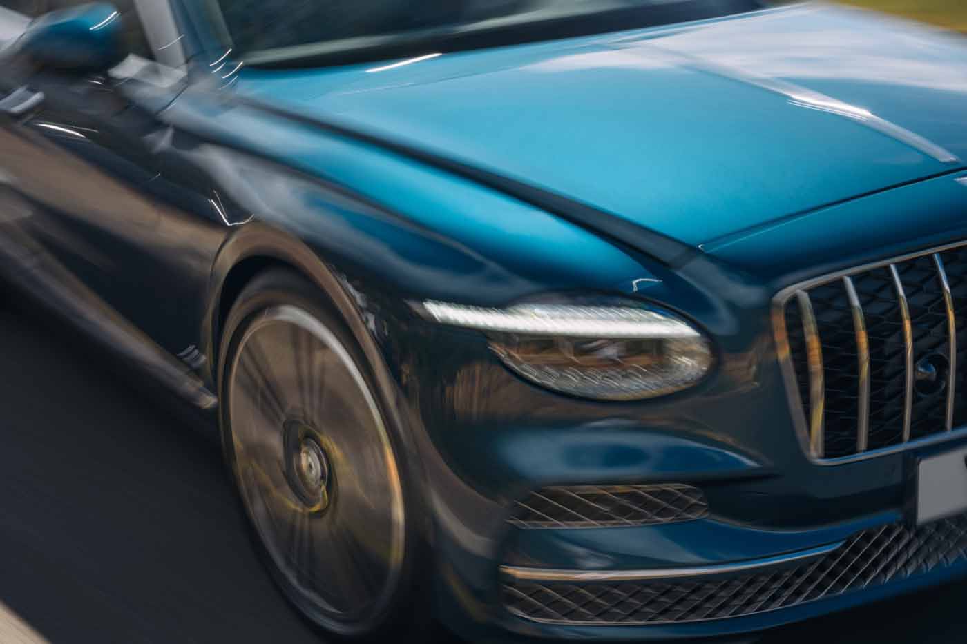 Front view of a 2027 Bentley Flying Spur Azure showing the new focused-eye headlamps and vertical vane grille