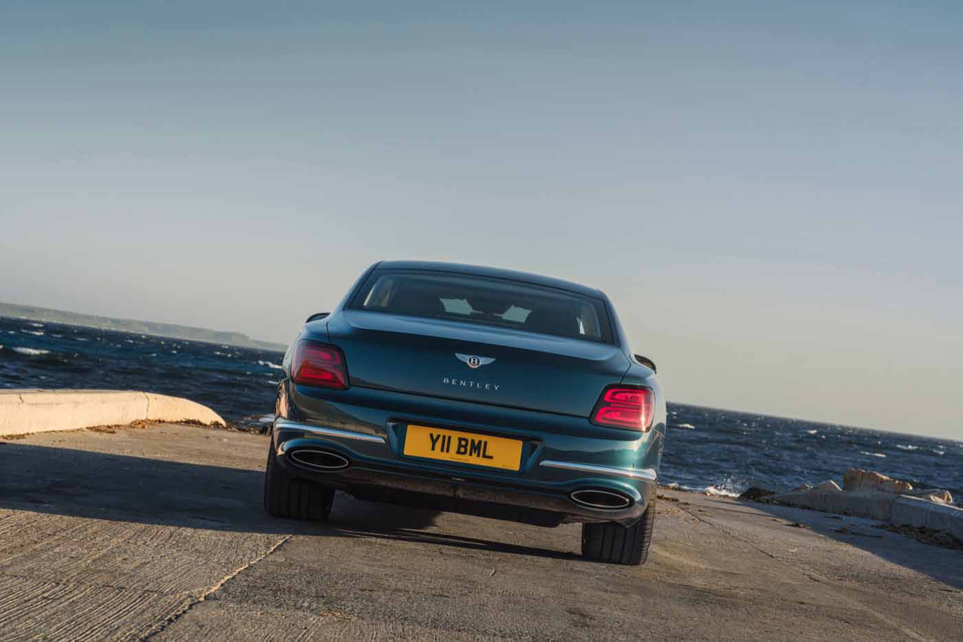 Rear view of a 2027 Bentley Flying Spur showing the new boot lid and illuminated B tail lamps