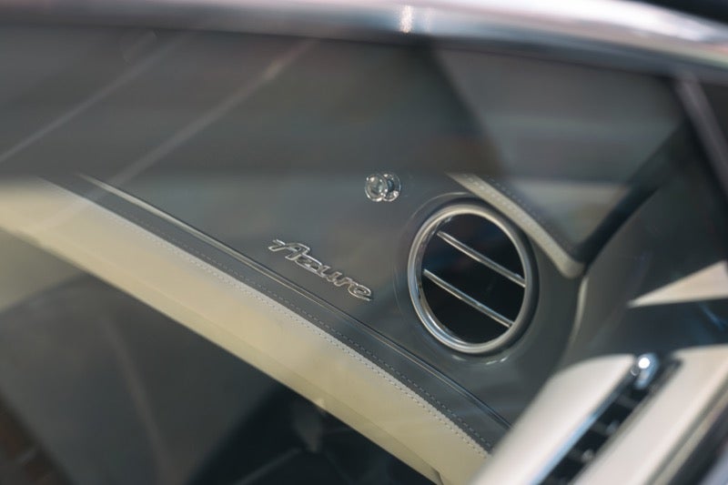 Veneer and bullseye air vent detail on a 2027 Bentley Flying Spur door