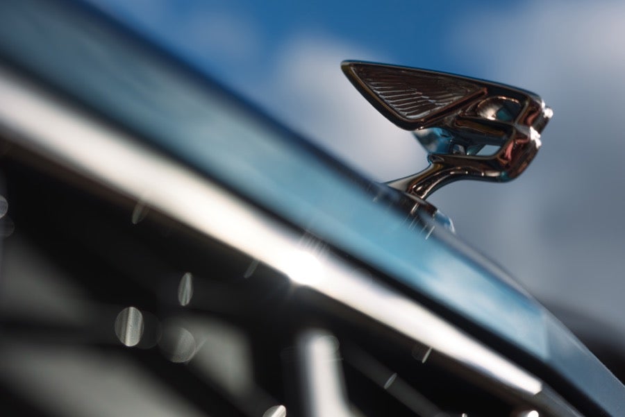 Close-up of the illuminated Flying B mascot on a 2027 Bentley Flying Spur