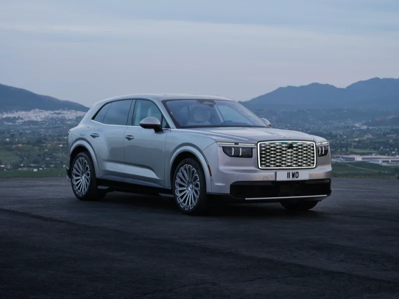 Bentley Torcal parked above a city at dusk