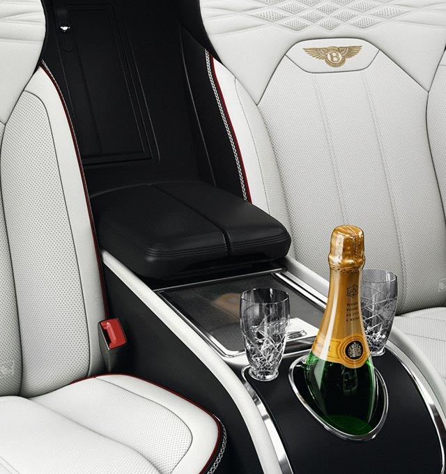 rear center console with champagne and glasses with embroidered leather seats
